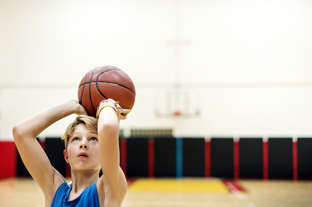 young-caucasian-boy-playing-shooting-basketball-stadium.jpg